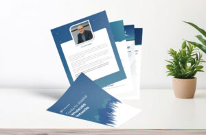 A stack of flyers on a white table, with one flyer displaying a profile image of a person and text. The cover flyer features a blue and white design with text about networks.