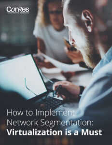 Man working on a laptop with two colleagues in an office setting. Text on the image reads: "How to Implement Network Segmentation: Virtualization is a Must.