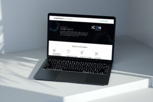 A laptop on a white surface displays a webpage with the title "Introducing ICON" from Windstream Wholesale. The screen shows various icons and text explaining ICON's benefits, including service enablement and expanded reach.