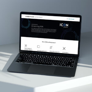 A laptop on a table displays a webpage for Windstream Wholesale's ICON service. The screen shows a dark-themed interface with text highlighting diverse benefits, immediate turnaround, and AI intelligence.