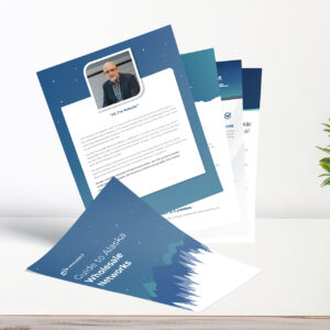 A brochure titled "Guide to Alaska Wholesale Networks" is displayed on a table. It features multiple pages, including an introduction with a man's photo and biography. A small plant is visible in the corner.