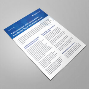 A document titled "East Irondequoit CSD claims victory over Emotet Trojan with Malwarebytes" is placed on a flat surface. The text is in blue and black with section headings discussing achievements, student data access, and network safety.