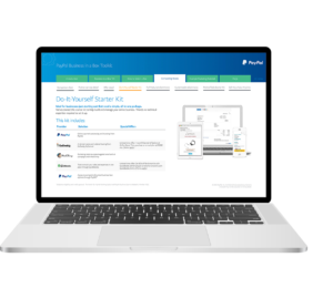A laptop displays the PayPal Business in a Box Toolkit webpage. The page features the Do-It-Yourself Starter Kit with logos for PayPal, Intuit QuickBooks, and WooCommerce, and details on setting up an online store.