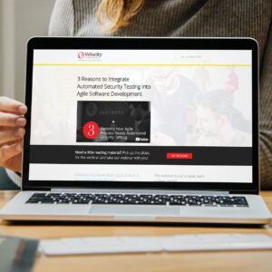 A person using a laptop displaying a website for "3 Reasons to Integrate Automated Security Testing into Agile Software Development." The page includes text about a webinar and a button to get slides.