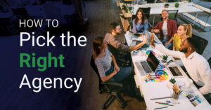 Office setting with six people smiling and high-fiving around a table with laptops, papers, and color swatches. Text on the left reads: "How to choose a brand design agency.